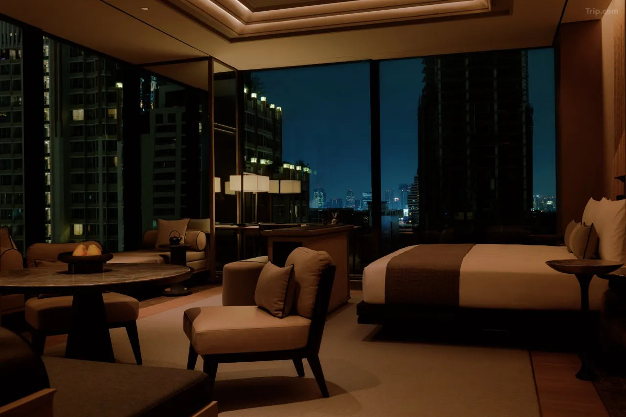 Aman Nai Lert Bangkok bedroom city view, warm lighting, luxury urban retreat