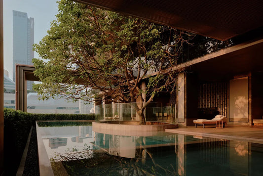 Aman Nai Lert Bangkok pool with tree, Thai design, luxury urban sanctuary hotel