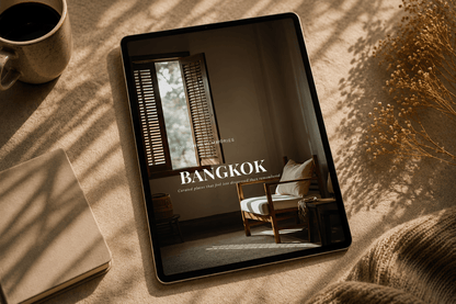 Bangkok travel guide - Borrowed Memories - cinematic digital guide displayed on a tablet with soft natural lighting, showcasing a serene interior.